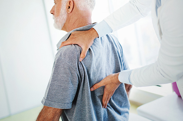 dr. jian shen checking a patient for myelopathy